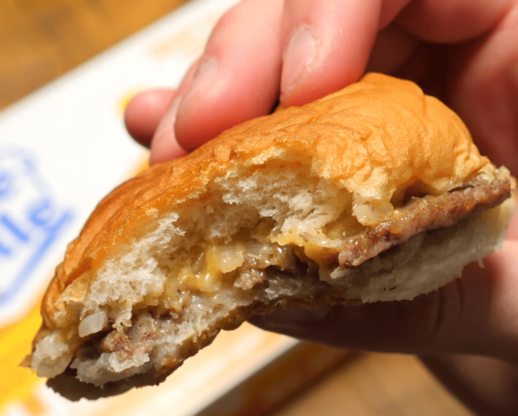 White castle burger with a bite in it