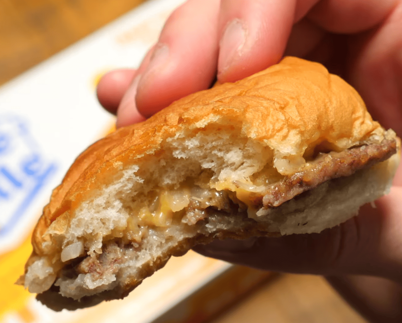 White castle burger with a bite in it